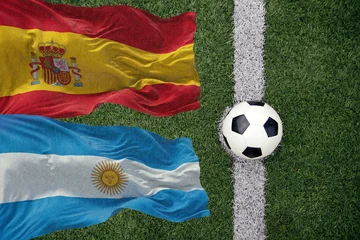Soccer ball and the flag of Argentina and Spain © erika8213