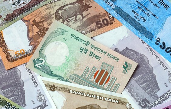 Bangladeshi taka money bills in pile. Big amount of Bangladesh BDT currency cash close up