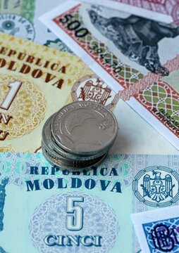Moldovan leu money bills and coins in pile. Big amount of Moldova MDL currency cash close up