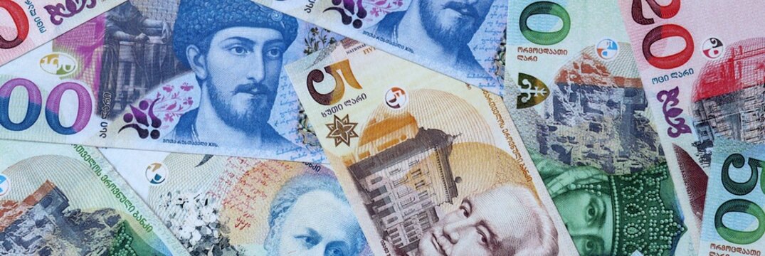 Georgian lari money bills in pile on table. Georgia GEL currency cash close up