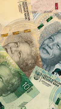 South African rand money bills in pile on table. South Africa ZAR currency cash close up