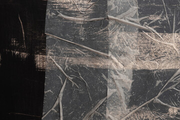 Crumble wrinkled paper pieces collage. Art Poster wall. Abstract grunge dirty black, beige white texture contrast background. © Liliia