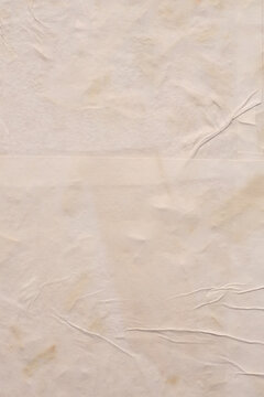 Crumble wrinkled paper pieces collage wall. Art Poster wall. Abstract grunge dirty beige white texture neutral collage background.