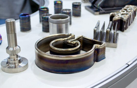 Different metal models created using 3D printing. Additive manufacturing. Metal alloy. Object printed on 3D printer from metal. Layer-by-layer deposition of metal thread. 3D printing