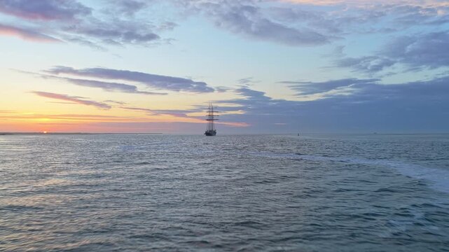 Tall ship gulden leeuw sailing on the sea at sunset