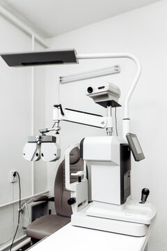 Professional autorefractor in a contemporary optometry office. Concept vision screening, ophthalmic technology, eye examination, healthcare, clinical diagnostics.