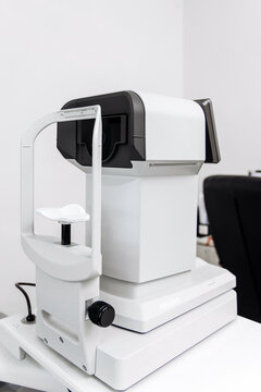 Modern autorefractor prepared for vision examination in an eye clinic. Concept ophthalmology, eye diagnostics, vision assessment, healthcare, medical equipment.