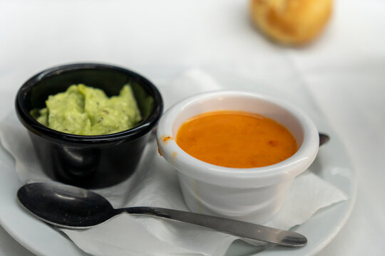 Lanzarote island  Canary Islands pdish Papas Arrugadas ( wrinkly potatoes) with Mojo picon (Red hot sauce) and Mojo verde ( Green sauce) on restaurant table