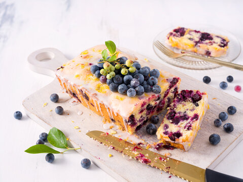 Homemade blueberry lemon loaf cake with fresh homegrown blueberries; copy space