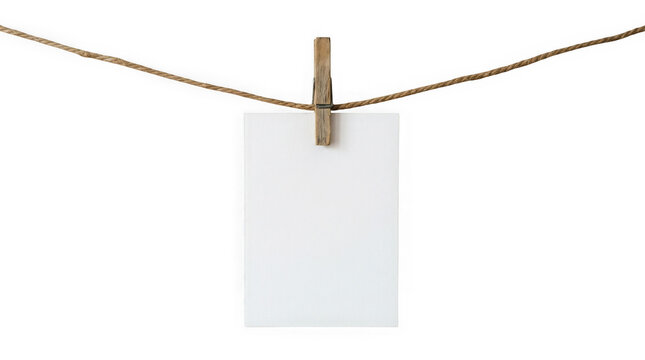 Blank white paper note hanging on a rope with a clothespin, isolated on transparent background
