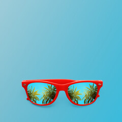Obraz premium Stylish sunglasses on light blue background. Tropical palm trees on sunny day reflecting in lenses