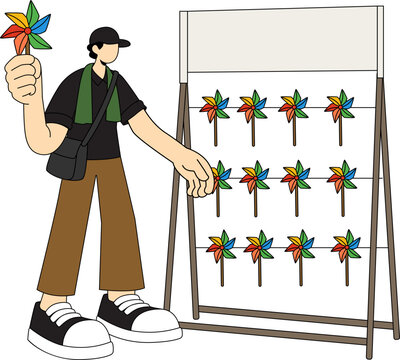 A person holding a pinwheel next to a rack displaying multiple colorful pinwheels. The person is wearing a cap, a dark shirt, and brown pants, with a bag slung over their shoulder