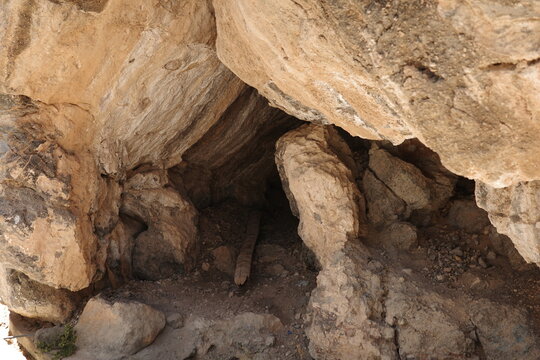Natural Cave Opening in Weathered Limestone Rock