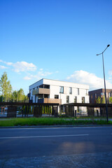 Modern contemporary apartment building with secure gated under croft parking. Business-class monolithic house with flats. City apartment in gated community. Suburb apartments in city City suburbs home © MaxSafaniuk