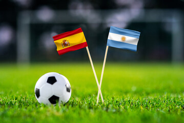 Fototapeta na wymiar Spain vs Argentina, Final, national flags before international football match, football on green grass with stadium in the background, East Rutherford, July 19, 2026.