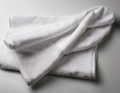 white towel draped on white surface