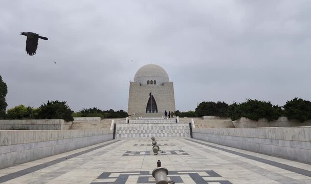 High-quality video of Mazar-e-Quaid, the mausoleum of Quaid-e-Azam Muhammad Ali Jinnah in Karachi, Pakistan. A famous national landmark featuring modern Islamic architecture, white marble, gardens,