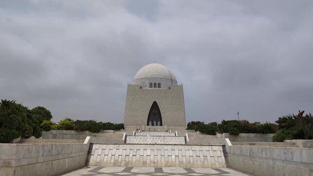 4K timelapse of Mazar-e-Quaid in Karachi, Pakistan. Fast-moving clouds highlight the iconic white marble mausoleum of Quaid-e-Azam Muhammad Ali Jinnah, a famous national landmark.