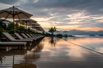 Fototapeta premium Pool Deck With Neatly Arranged Umbrellas And Reflections After Rain Creates A Calm Resort Scene
