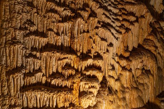 a massive, intricate flowstone formation called "The Organ" and layered cave drapery inside the Obir Dripstone Caves (Obir Tropfsteinh&ouml;hlen), highlighted by dramatic subterranean tourist lighting