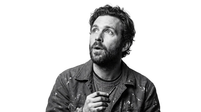 Surprised Male Artist Looking Up in Awe, Black and White Portrait Isolated