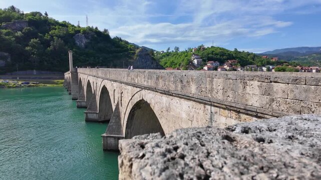 Visegrad, Bosnia and Herzegovina - May 30, 2026: Aerial view of the historic Mehmed Pa&scaron;a Sokolović Bridge spanning the Drina River