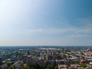 Obraz premium Residential buildings sprawling urban area under blue sky