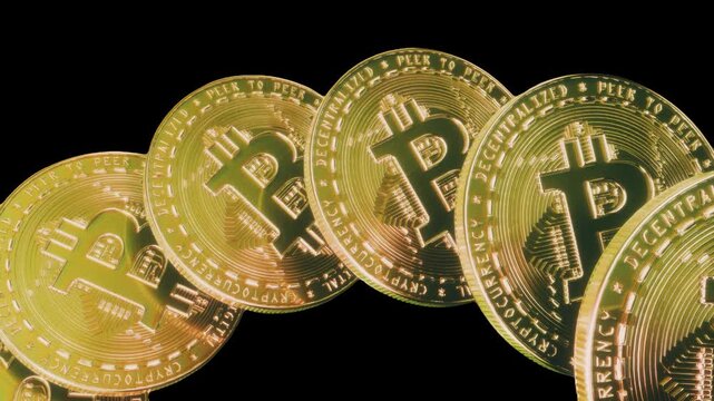 Golden bitcoin coins tilted in a row with transparent background alpha channel as a seamless loop overlay ideal for crypto streaming graphics or video editing