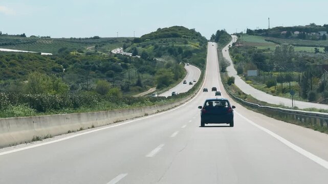 POV Driving on Winding Greek Highway Through Green Hilly Landscape