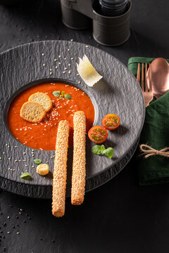 Exquisite and tasty tomato soup as culinary artistry on plate.