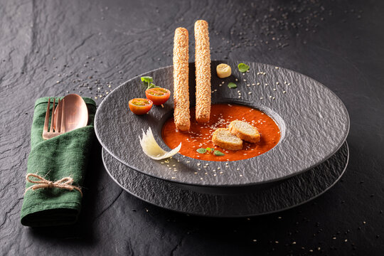 Professional and healthy tomato soup as sophisticated food in restaurant.