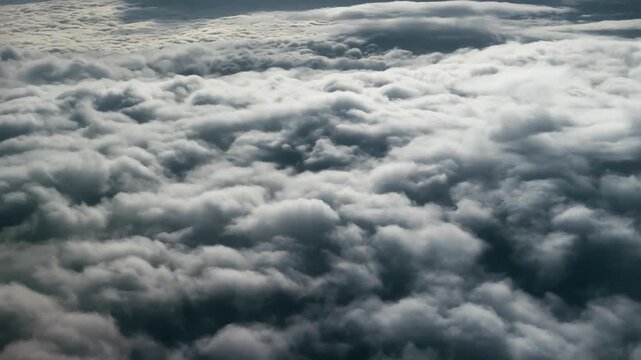 Breathtaking Aerial Flight Above Layers of Fluffy Clouds