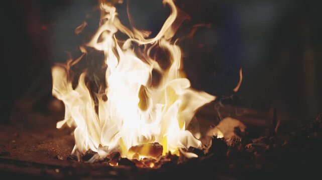 Blacksmith Forge Fire Heating Metal in Traditional Workshop