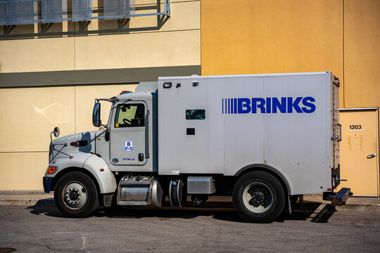 Brinks armored security truck parked beside a building. Toronto, Canada - July 13, 2026.