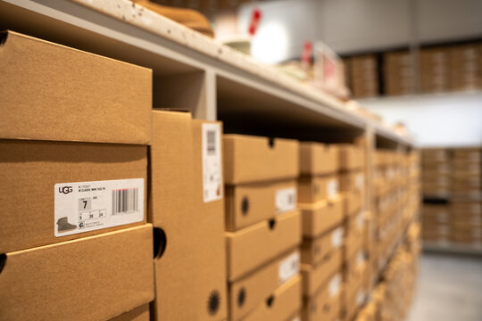 Close up of stacked UGG shoe boxes. Toronto, Canada - July 13, 2026.