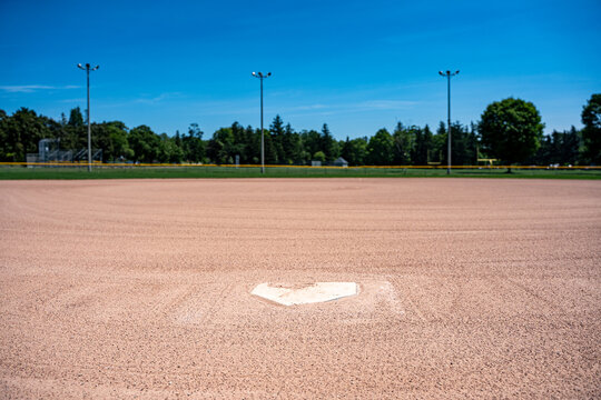 Empty baseball field viewed from home plate.