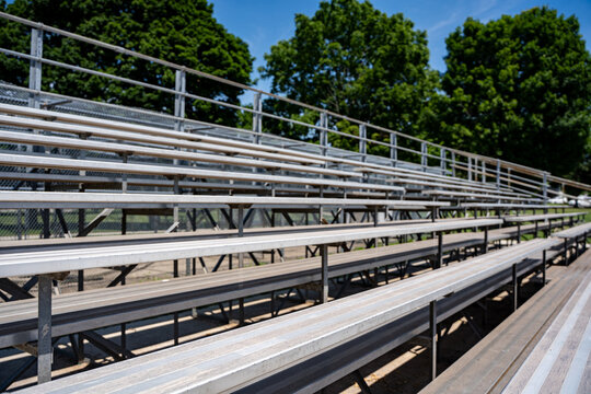 Empty metal bleachers at outdoor sports field.