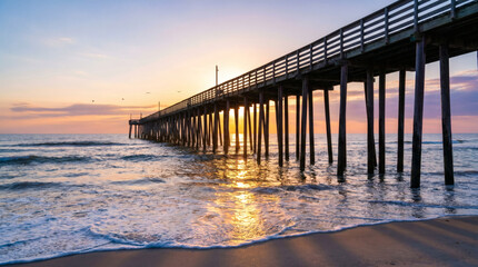 Fototapeta premium Scenic ocean pier at sunset with vibrant sky and reflections