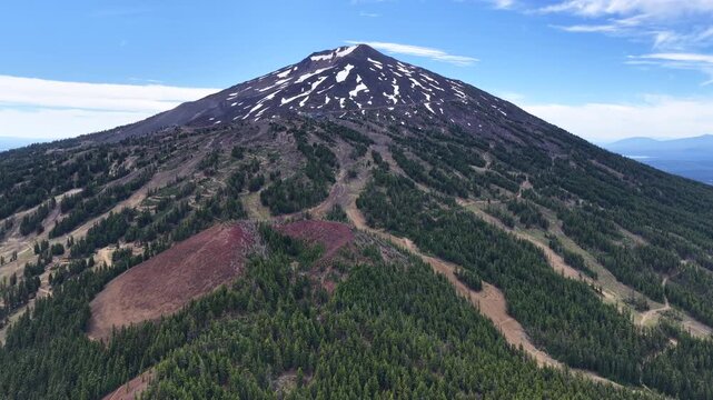 Mt. Bachelor and its many ski trails rise from the Deschutes National Forest in Oregon. This iconic volcanic mountain is part of the Cascade Range and just 22 miles from Bend.