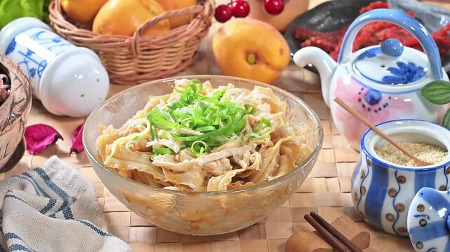 Cold noodles with chicken sichuan pepper and scallion in the glass bowl