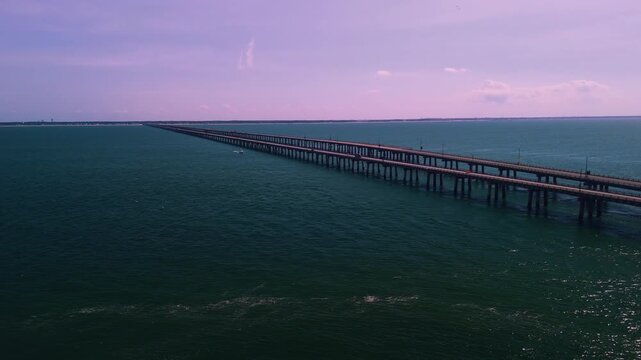 Aerial cinematic view of the Chesapeake Bay Bridge-Tunnel trestle and island in the Hampton Roads region of Virginia