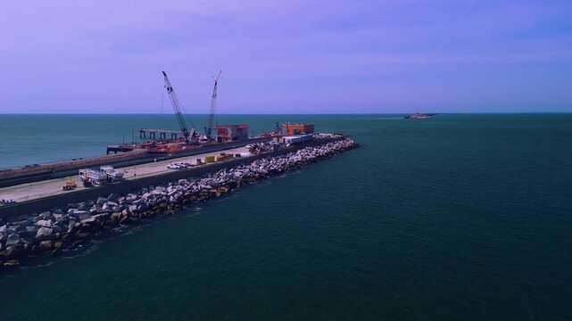 Aerial cinematic view of the Chesapeake Bay Bridge-Tunnel trestle and island in the Hampton Roads region of Virginia