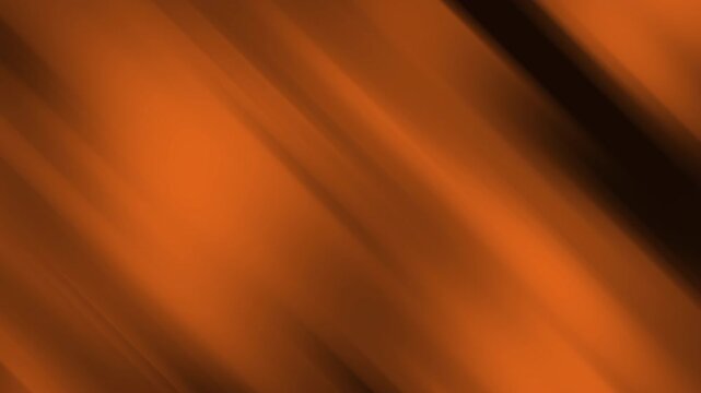 Halloween gradient background with burnt orange and deep black motion. Dynamic glowing textures create a spooky atmospheric effect for seasonal creative projects.