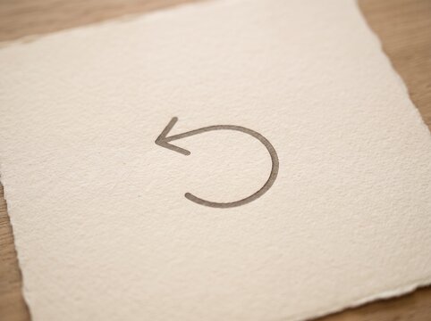 Simple Circular Arrow Icon on Textured Paper.