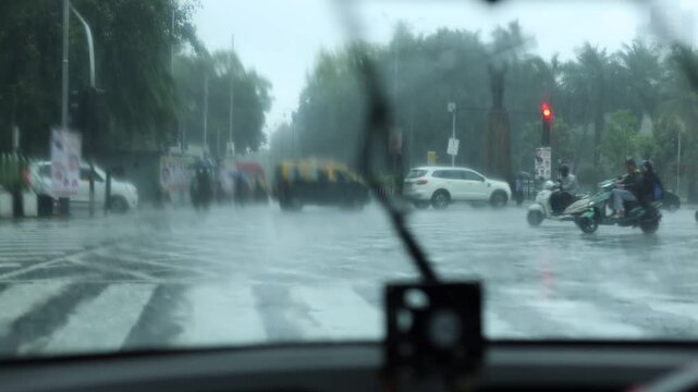Sitting in a car during rain in Mumbai city India