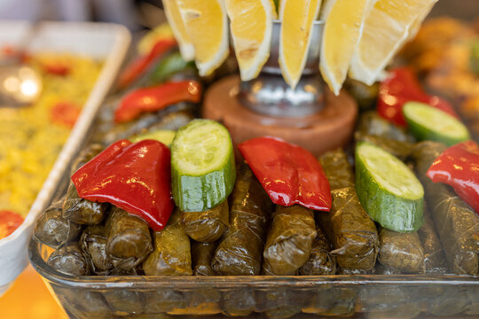 Traditional Turkish sarma dolma with fresh vegetables and lemon