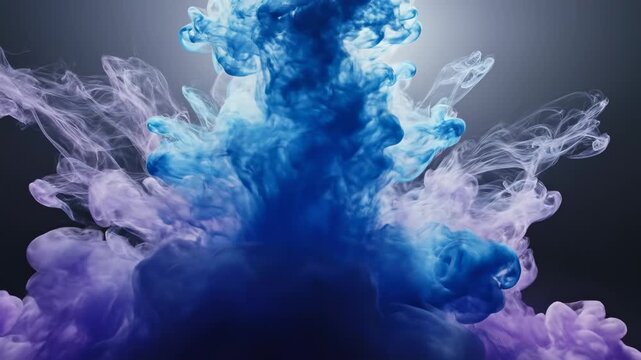 Blue and purple ink clouds swirling and dissolving in water, abstract explosion of color, fluid motion effect