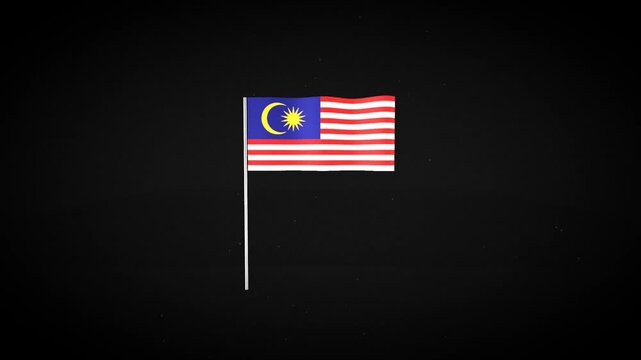 Three Malaysian flags isolated on black