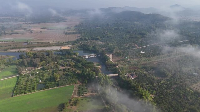 Aerial view of small spillway in Pa Daet district in Chiang Rai province of Thailand. Spillway, passage for surplus water over or around a dam when the reservoir itself is full.
