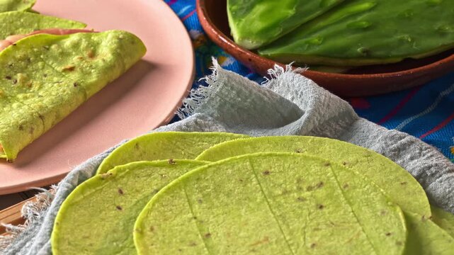 Cactus tortillas in the background quesadillas with nopal tortilla and cactus on a clay plate